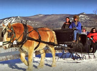 Victorian horse drawn sleigh ride at Farm by the River Stables in North Conway NH